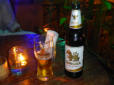 Singha øl i San Migual glas.